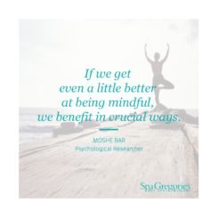 Picture with woman doing yoga by the beach with text over it that says "If we get even a little better at being mindful, we benefit in crucial ways," a quote from Moshe Bar, a psychological researcher.
