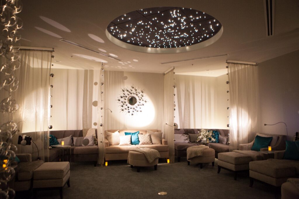 relaxation room with starry light ceiling, sheer curtains and soft lighting